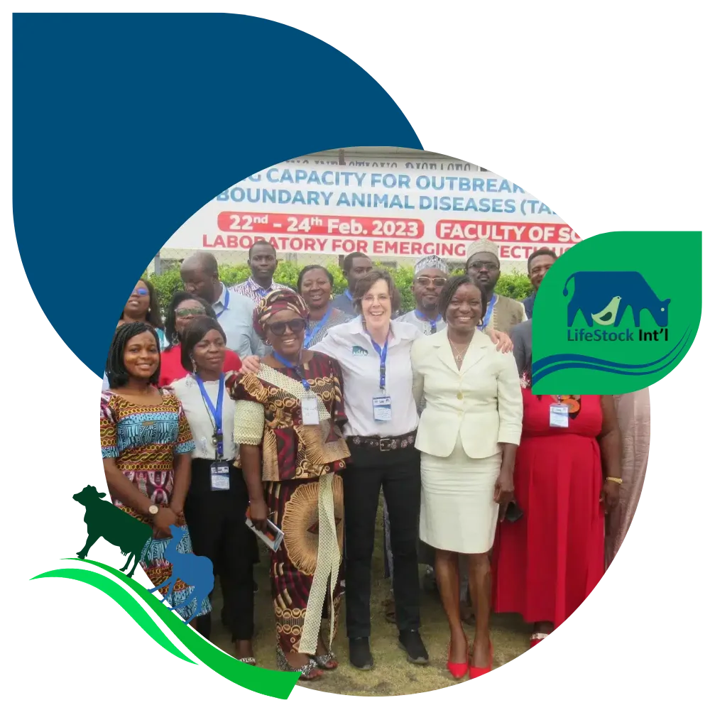 Group of people posing at an animal disease outbreak training event, framed with LifeStock Int’l blue and green branding.